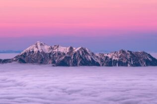 Tops of mountains rising above clouds