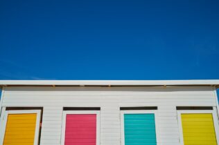 White house with brightly painted windows