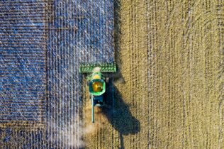 Aerial shot of green milling tractor