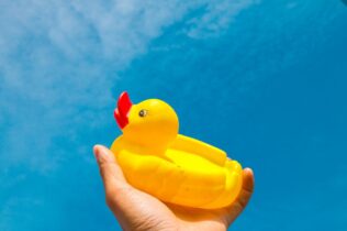 Rubber duck against a blue sky