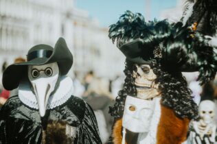 Venetian festival masks in festival parade